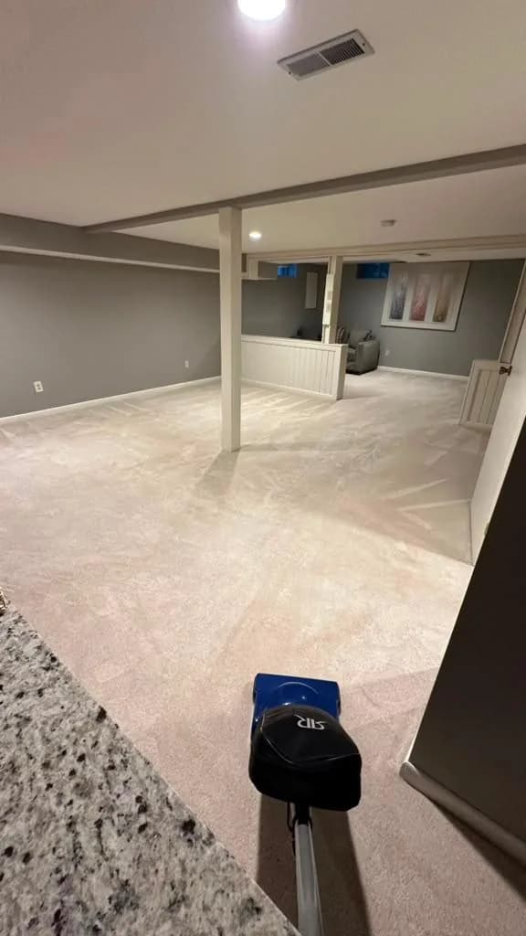 Finished basement with freshly vacuumed carpet by Dolane Cleaning Services