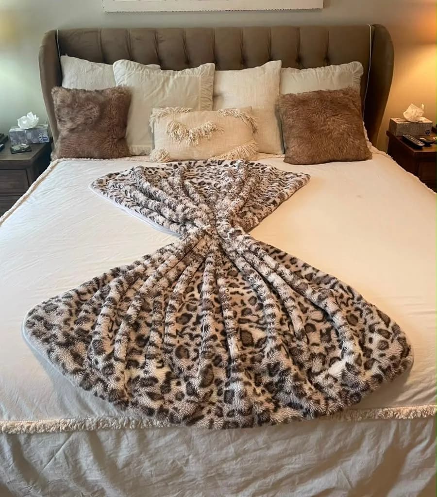 Bedroom with the bed freshly made and a throw folded into place by Dolane Cleaning Services
